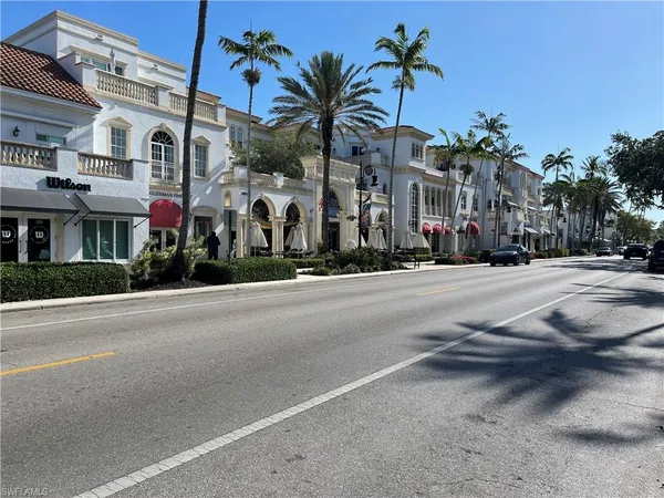 a view of a street with cars