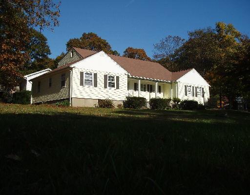 66 Berrian Road Stamford, CT 06905 - Photo 1 of 1 a front view of a house with a garden