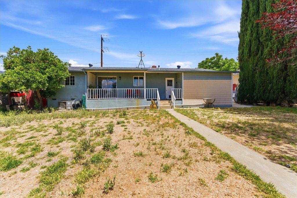 34863 Wildwood Canyon Road Yucaipa, CA 92399 - Photo 18 of 22 a view of a house with a yard