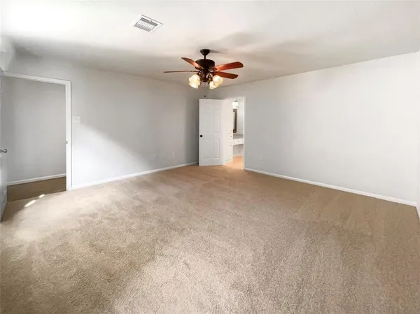 a view of a chandelier fan in a room