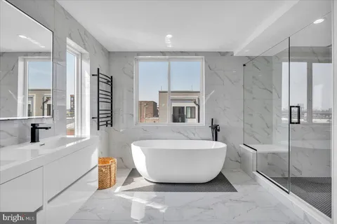 a bathroom with a bathtub and shower