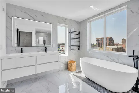 a bathroom with a bathtub and a sink