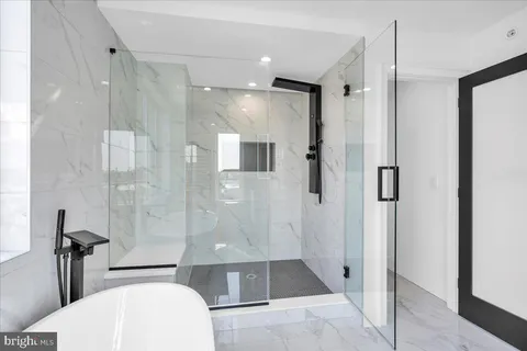 a bathroom with a shower and a toilet
