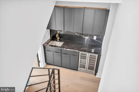 a kitchen with a sink and cabinets