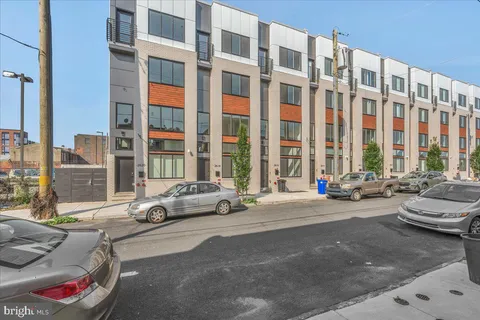 a view of a car parked in front of a buildings
