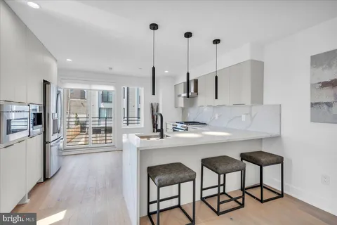 a kitchen with counter top space and appliances