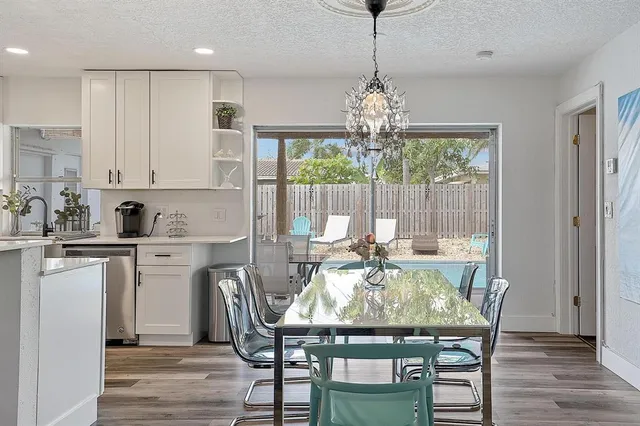 a view of a dining room with furniture window and outside view