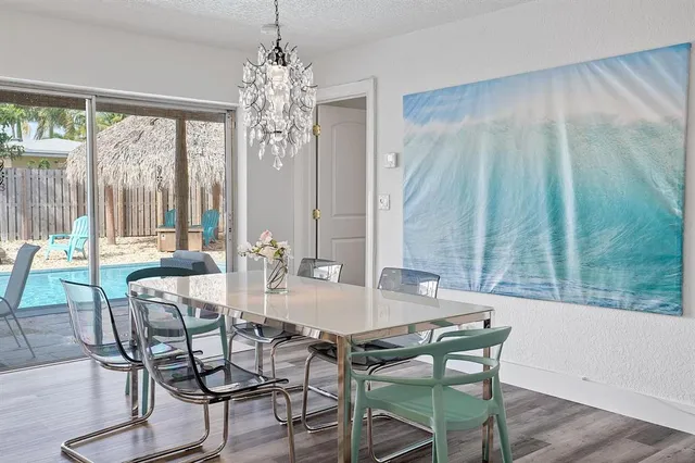 a view of a dining room with furniture window and outside view