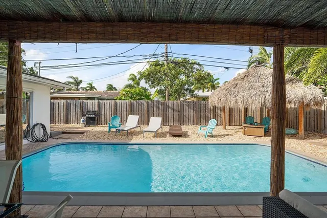 a view of a living room and floor to ceiling window