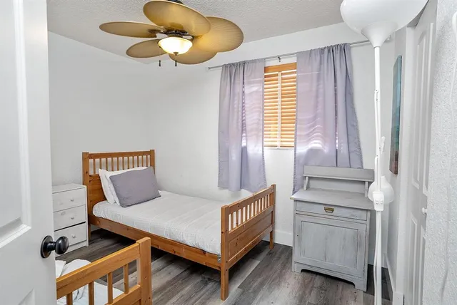 a bedroom with furniture and a window