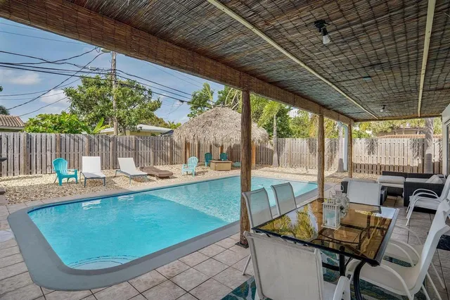 a view of a swimming pool with a patio