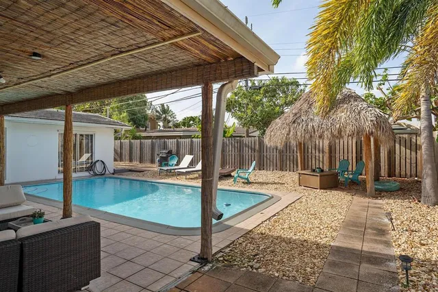 a view of a patio with a table chairs and a patio