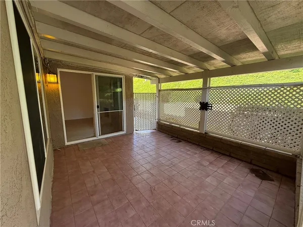 a view of a room with wooden walls