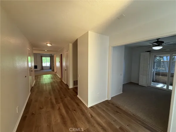 a view of gallery with wooden floor
