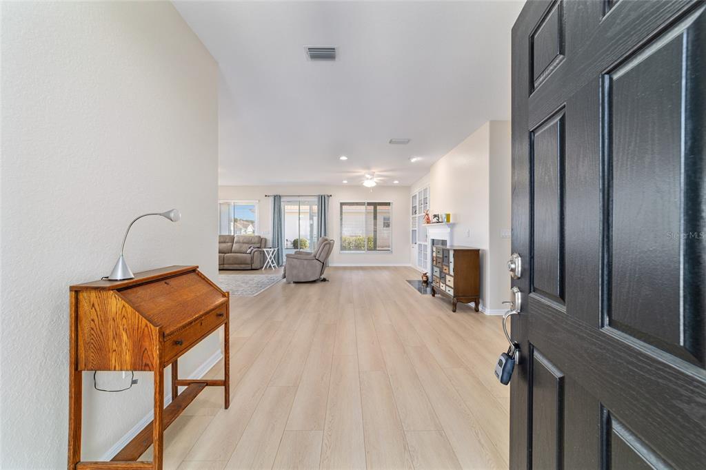 9612 Southeast 124th Loop Summerfield, FL 34491 - Photo 11 of 60 a room with furniture and a wooden floor