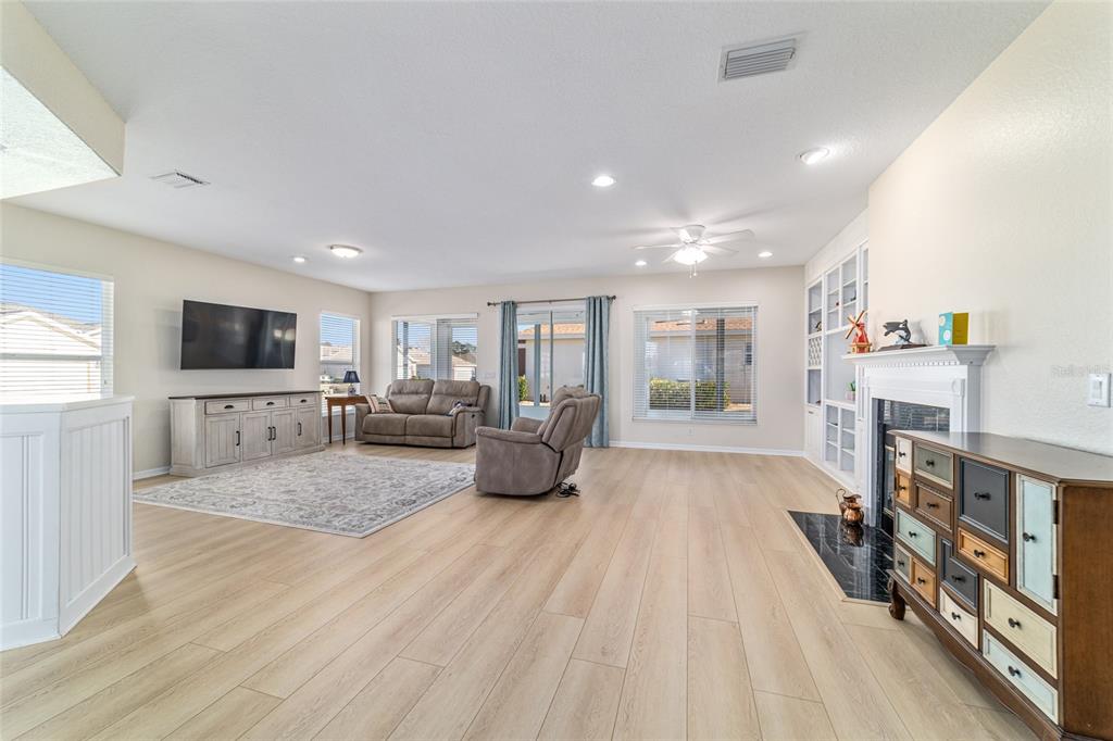 9612 Southeast 124th Loop Summerfield, FL 34491 - Photo 13 of 60 a living room with furniture and a flat screen tv