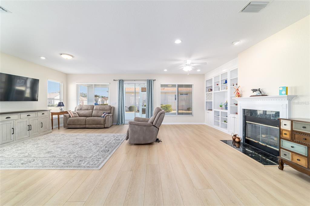 9612 Southeast 124th Loop Summerfield, FL 34491 - Photo 14 of 60 a living room with furniture and a flat screen tv