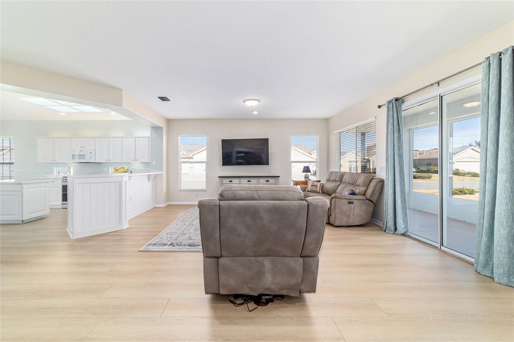 9612 Southeast 124th Loop Summerfield, FL 34491 - Photo 15 of 60 a living room with furniture and a flat screen tv