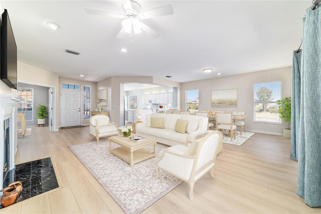 9612 Southeast 124th Loop Summerfield, FL 34491 - Photo 16 of 60 a living room with furniture and a flat screen tv