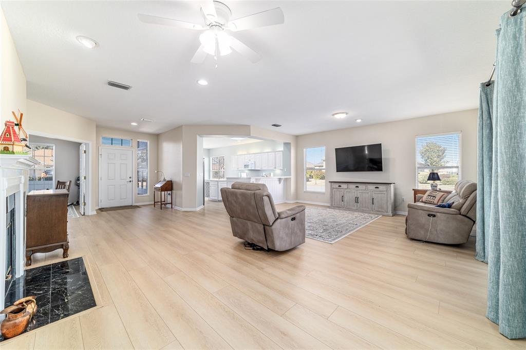 9612 Southeast 124th Loop Summerfield, FL 34491 - Photo 17 of 60 a living room with furniture and a flat screen tv