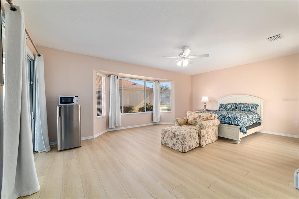 9612 Southeast 124th Loop Summerfield, FL 34491 - Photo 31 of 60 a living room with furniture and a chandelier