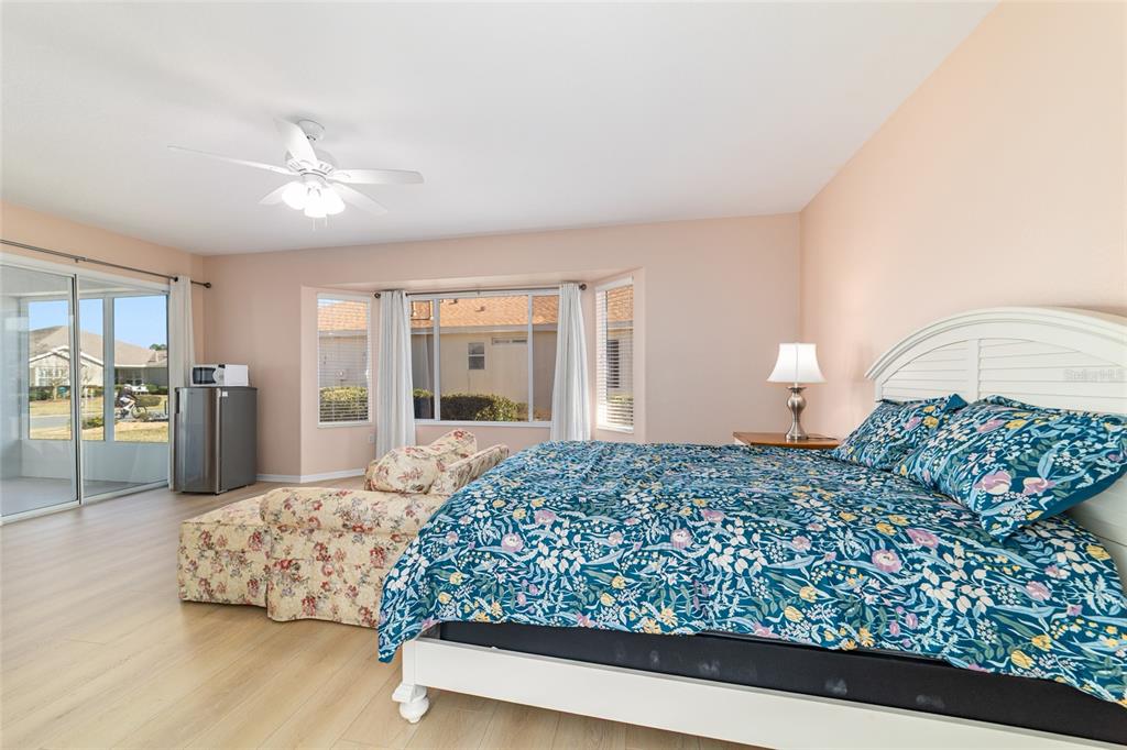 9612 Southeast 124th Loop Summerfield, FL 34491 - Photo 35 of 60 a living room with a bed furniture and kitchen view