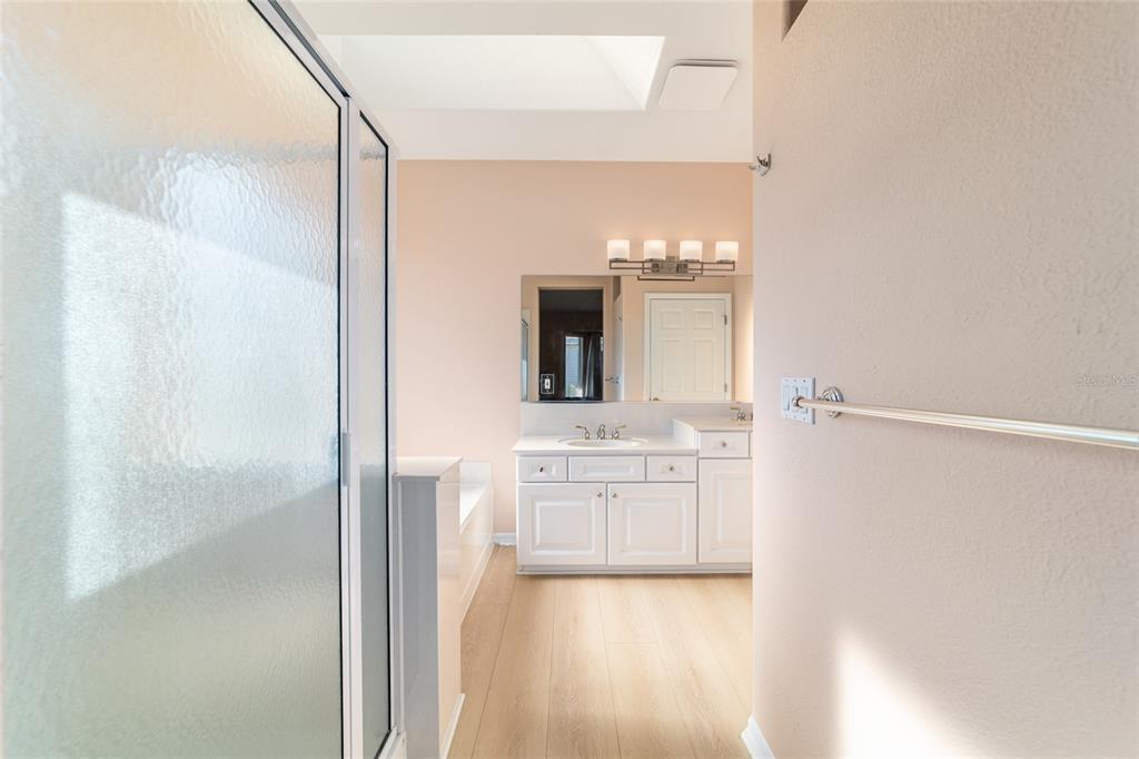 9612 Southeast 124th Loop Summerfield, FL 34491 - Photo 36 of 60 a bathroom with a bathtub and a mirror