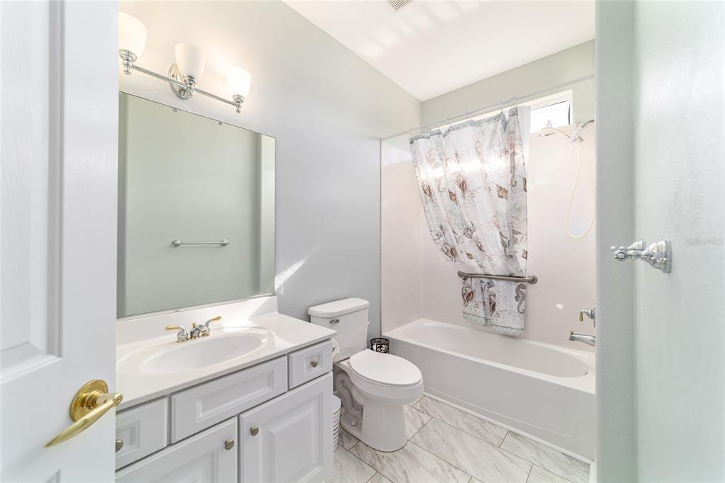 9612 Southeast 124th Loop Summerfield, FL 34491 - Photo 42 of 60 a bathroom with a sink toilet and shower