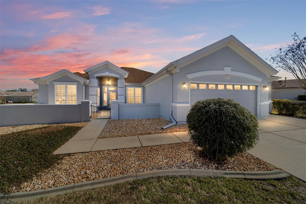 9612 Southeast 124th Loop Summerfield, FL 34491 - Photo 5 of 60 a front view of a house with a yard