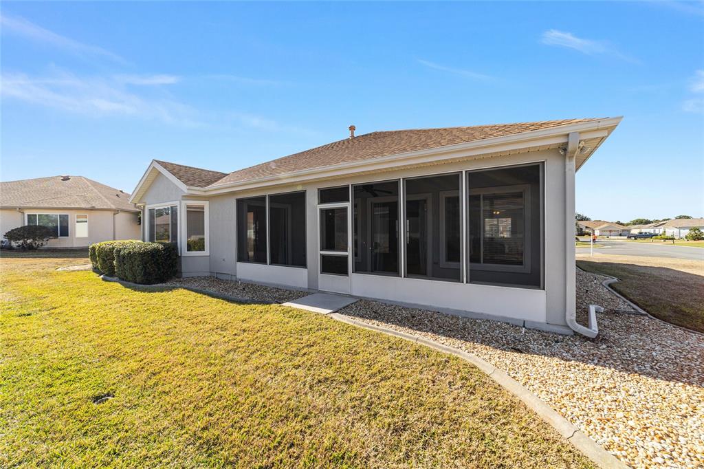 9612 Southeast 124th Loop Summerfield, FL 34491 - Photo 56 of 60 a view of a house with a swimming pool with a yard