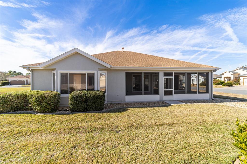 9612 Southeast 124th Loop Summerfield, FL 34491 - Photo 58 of 60 a front view of a house with a yard