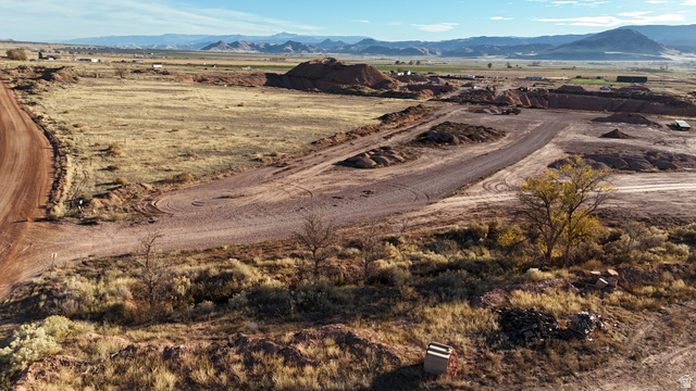 2600 Sevier Valley Canal Road Richfield, UT 84701 - Photo 8 of 63 Aerial view of property and surrounding area featuring a mountainous background and rural landscape