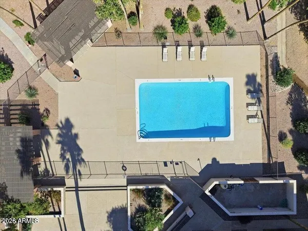 a view of a swimming pool with a patio