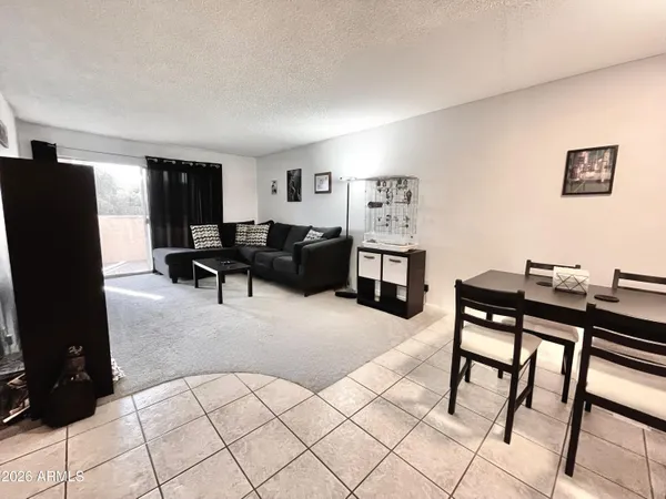 a living room with furniture and a table