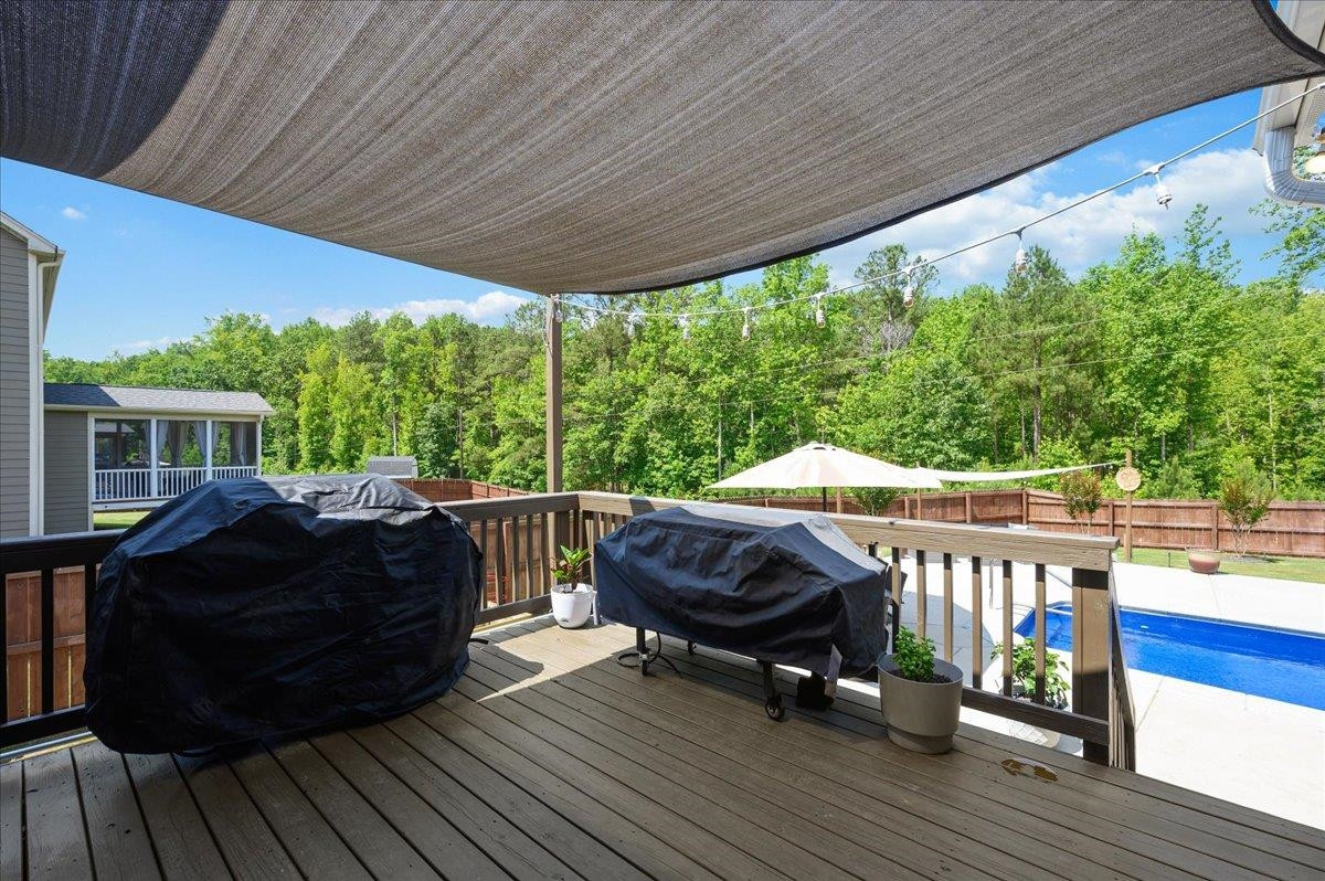 7032 Rex Road Holly Springs, NC 27540 - Photo 31 of 38 With natural gas connections, this grilling deck is ready for your summer days! Grilling deck