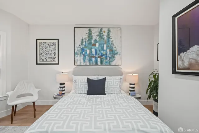 a bedroom with a bed and glass window