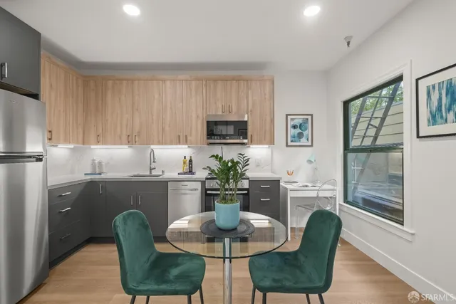 a kitchen with a table and chairs