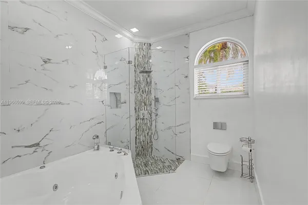 a bathroom with a sink a toilet and a bathtub