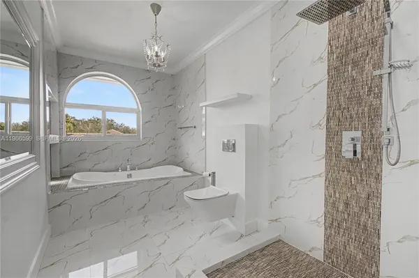 a bathroom with a granite countertop sink a toilet a mirror and shower
