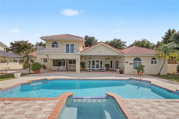 a front view of house with yard and outdoor seating