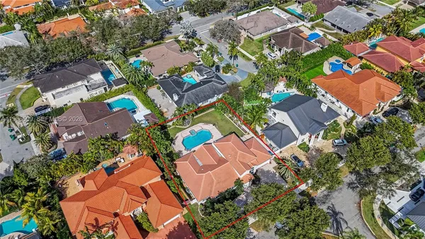 an aerial view of residential houses with outdoor space