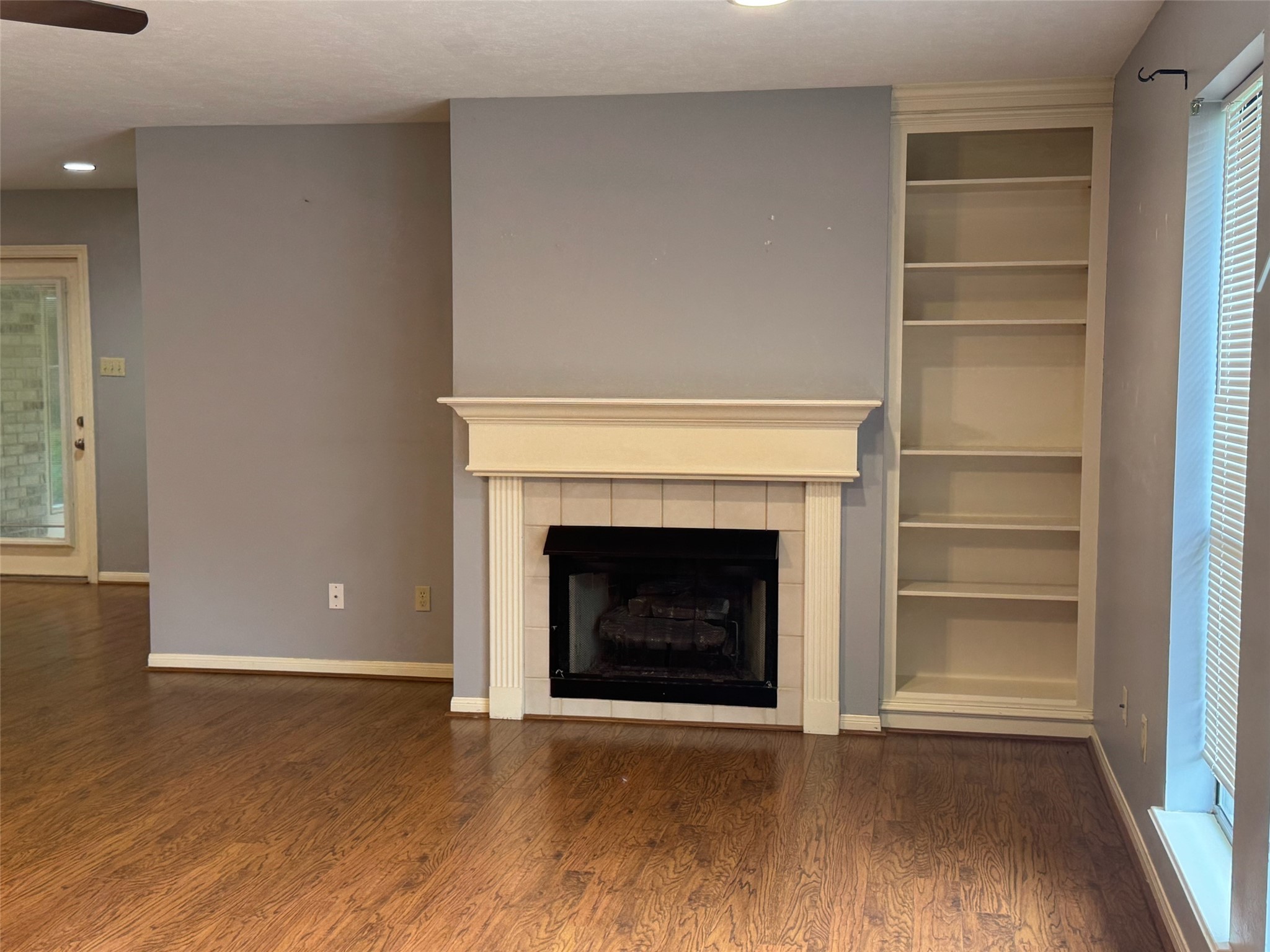 2232 Azalea Circle Huntsville, TX 77340 - Photo 8 of 24 Family room with fireplace and windows
