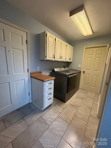 a view of a kitchen with electric appliances