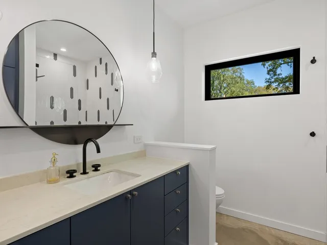 a swimming pool with outdoor seating and yard