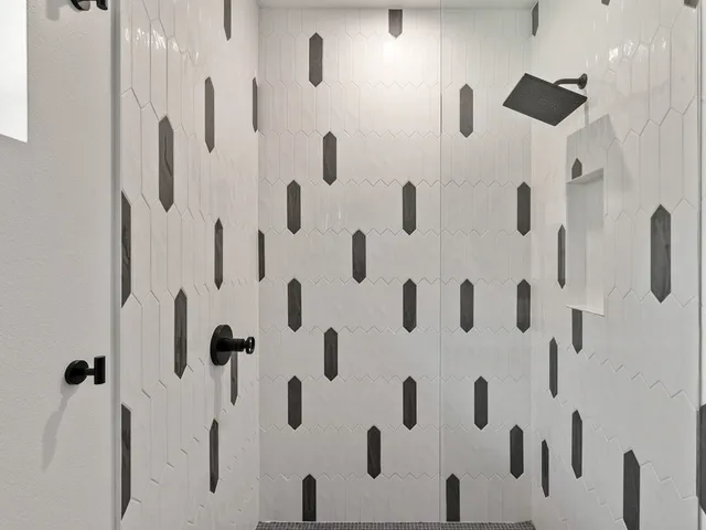 a view of a house with a yard and large tree