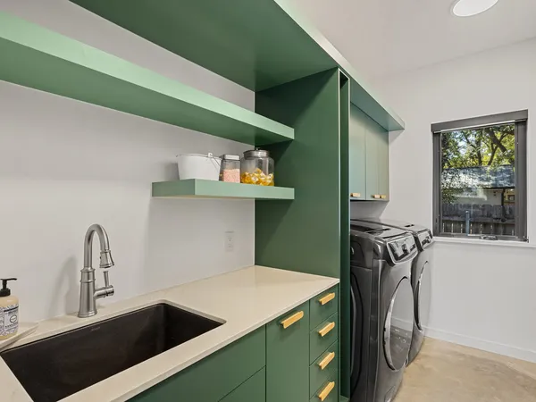 a bathroom with a table chairs and a fireplace