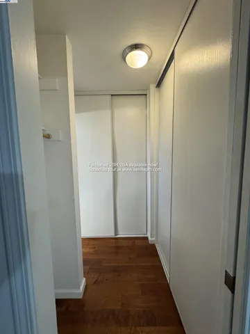 a view of a bathroom with wooden floor