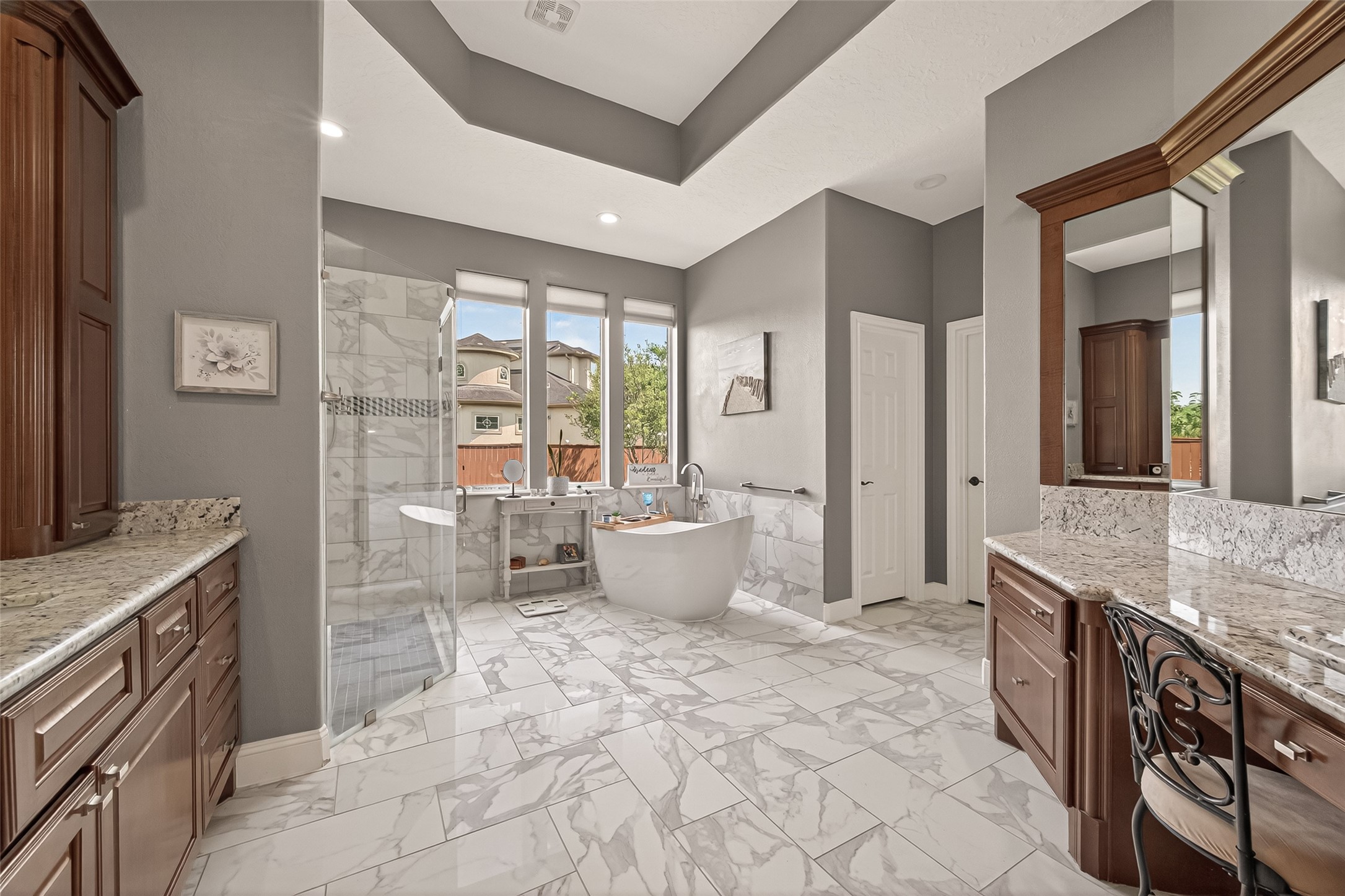 2319 Braer Ridge Drive Katy, TX 77494 - Photo 25 of 50 a spacious bathroom with a granite countertop sink a large mirror and a shower