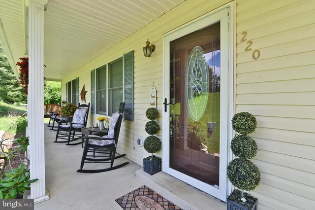 a view of a dining room and tables and chairs and potted plants