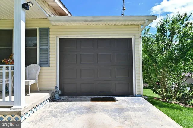 a view of deck with table and chairs